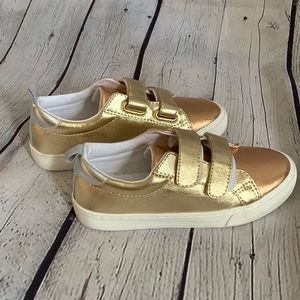 Gold tennis shoes